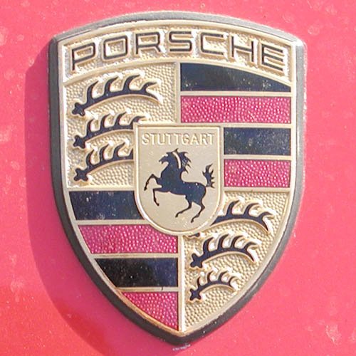 Porsche logo beside its brand color palette: gold #EBD698, black #000000, red #B12B28